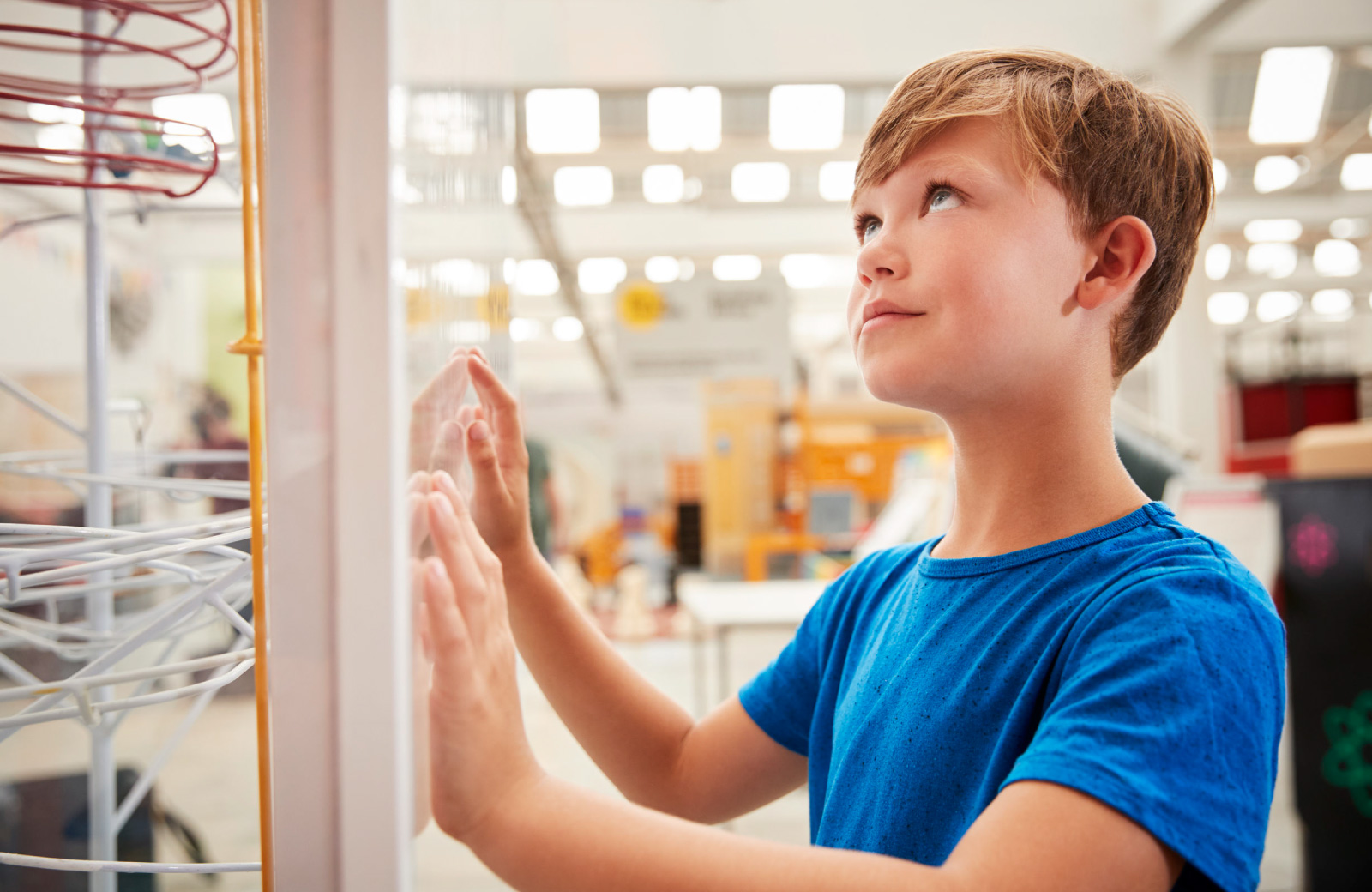boy checking out an artwork