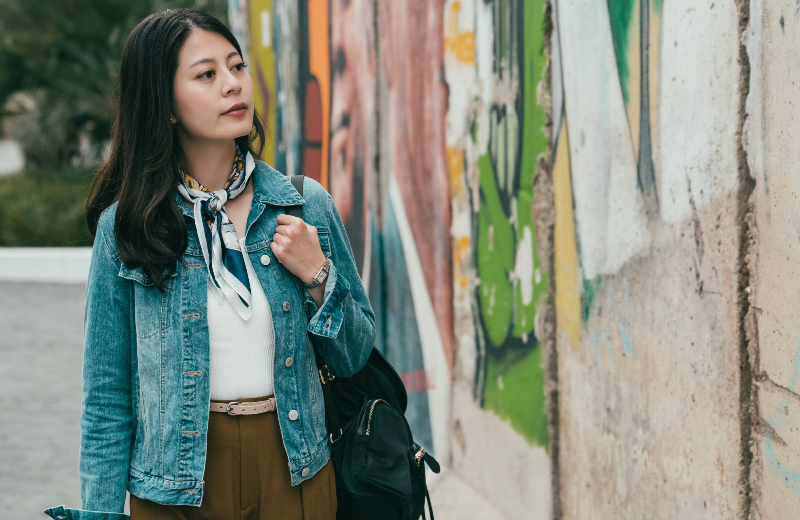woman looking at street art
