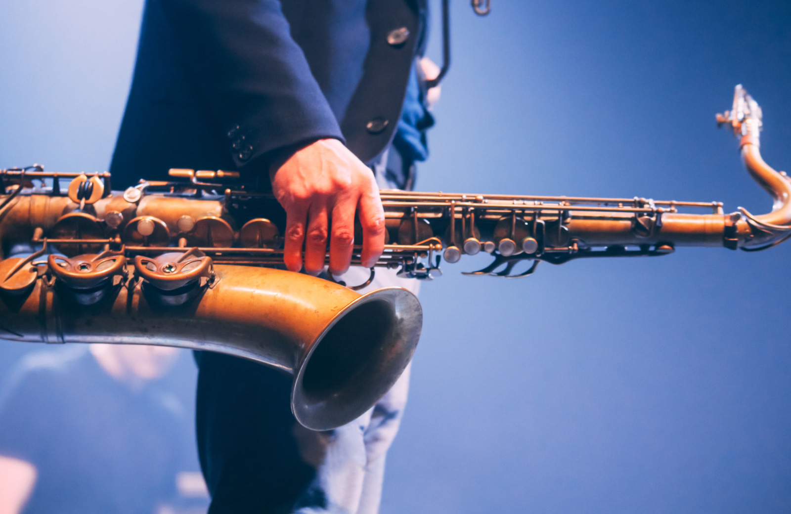 man holding a saxophone