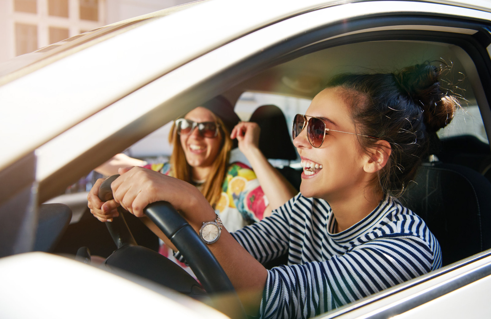 young women in a car