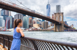 Woman looking at the Brooklyn Bridge