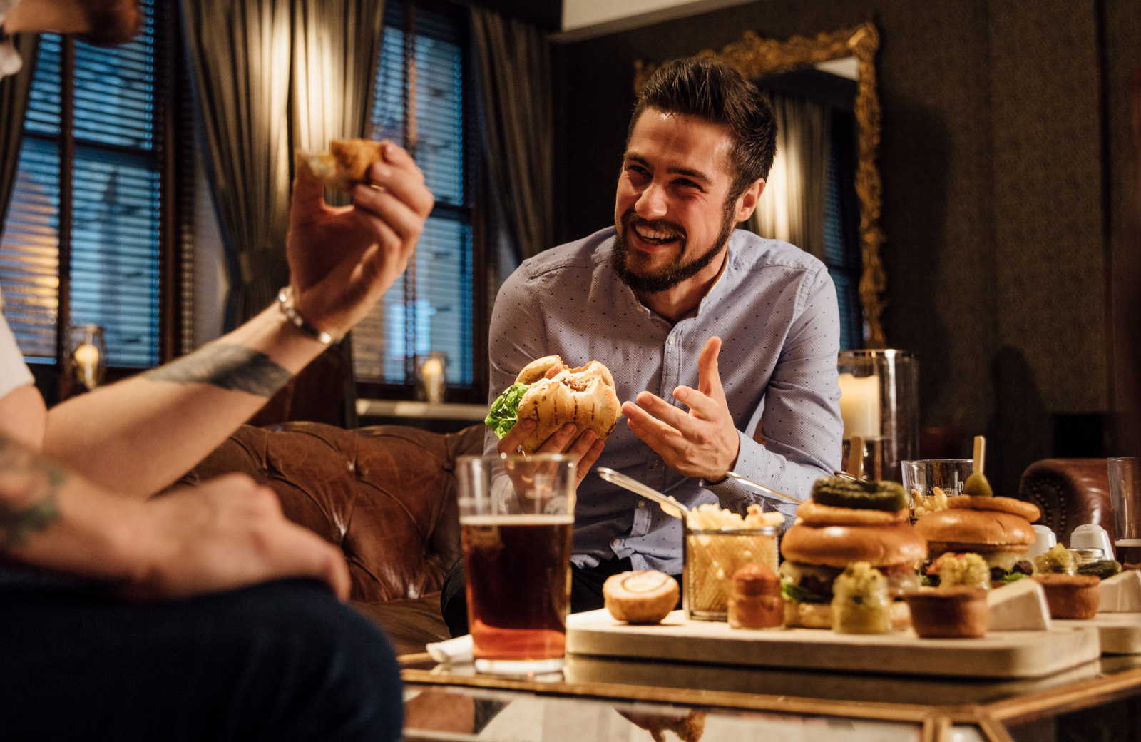 man sharing a meal with friend