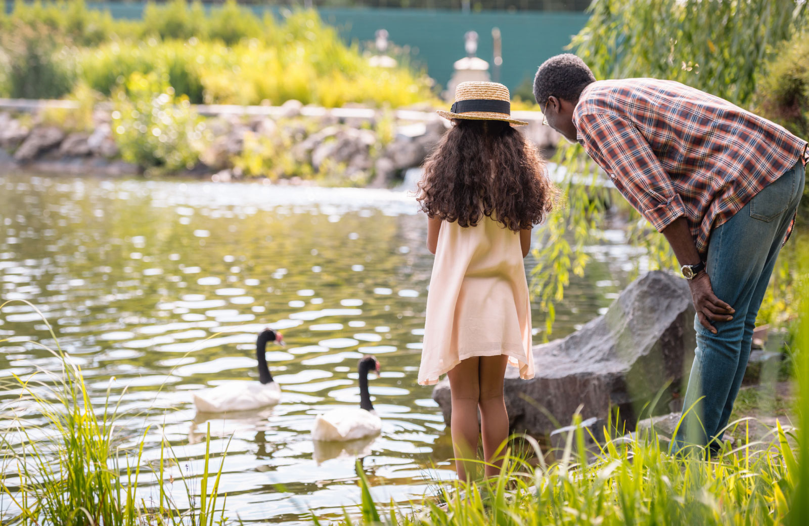 father and daughter sightseeing in park