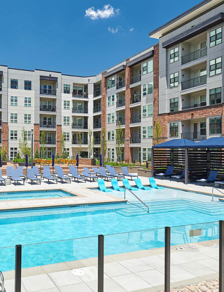 close up of large courtyard swimming pool - The Henry luxury apt building amenities