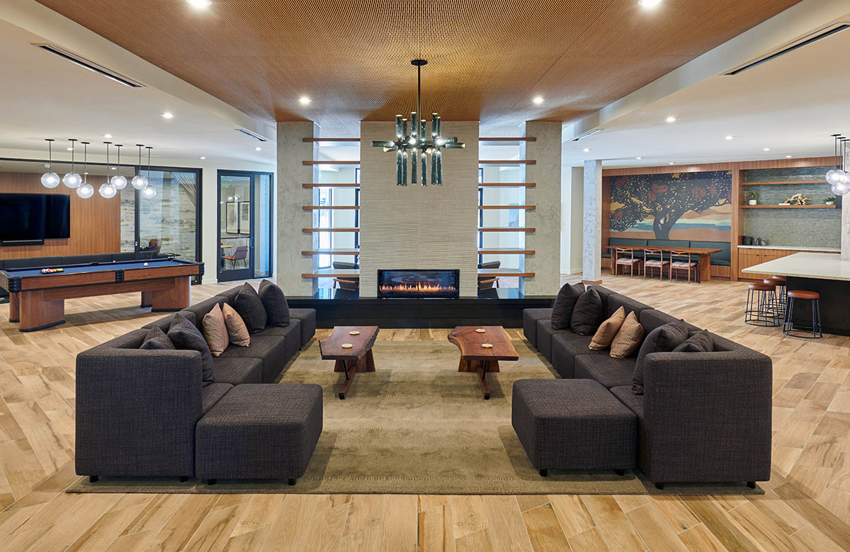 large community room with ample seating and lounge area - The Henry luxury apt building amenities
