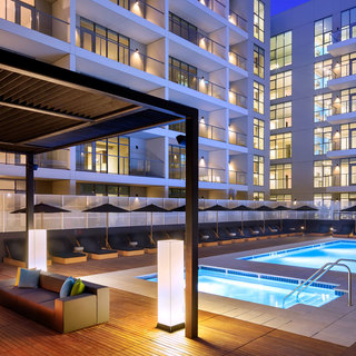 Lounge seating under the courtyard trellis on the pool deck