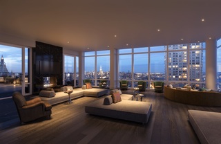 Wall to wall windows, modern lounge seating and a fireplace in the building's sky lounge.
