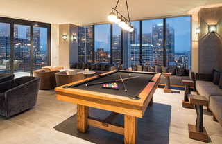 Billiard table and clubroom seating in the Atelier game lounge
