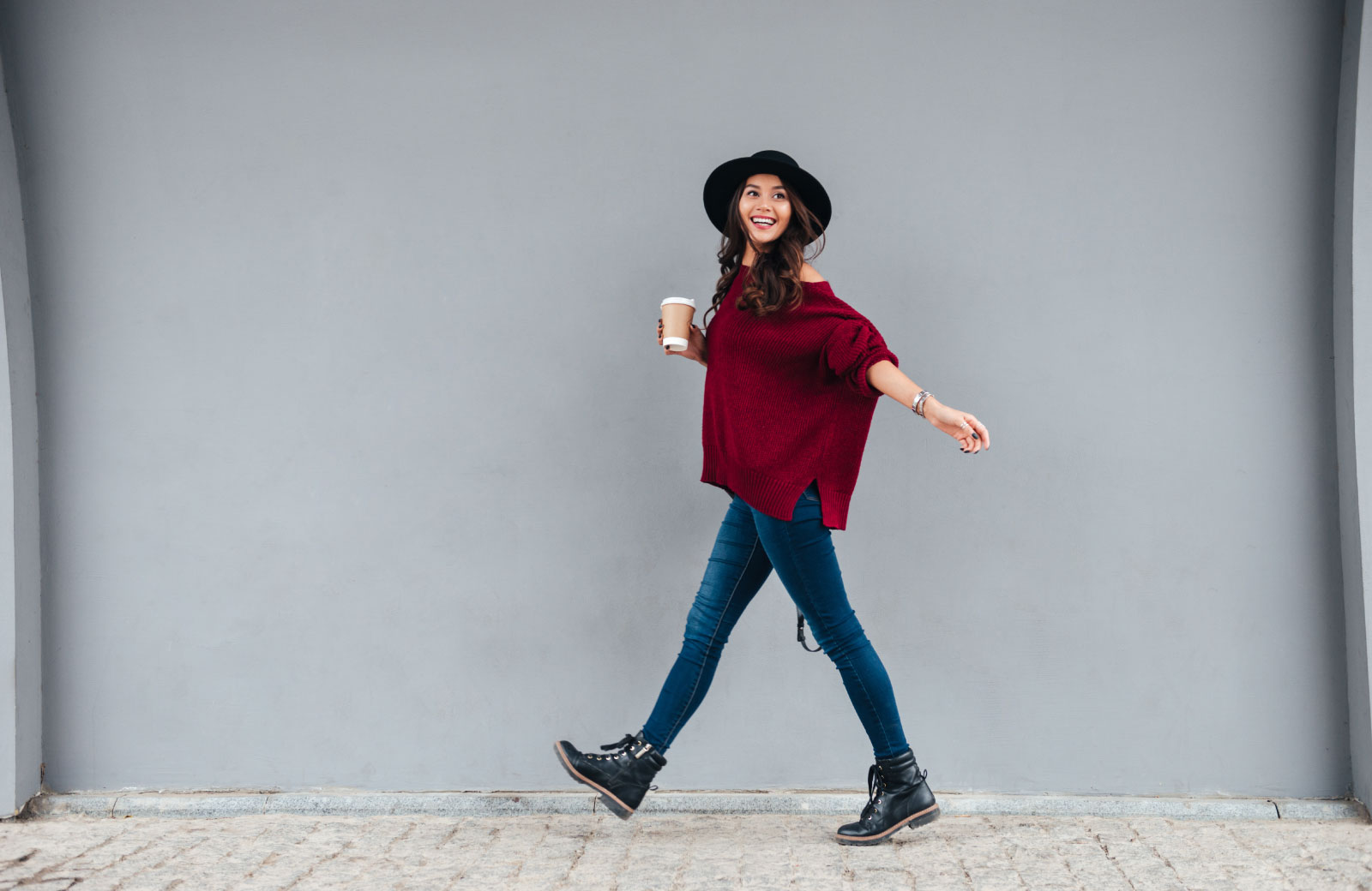 woman strolling with coffee in hand