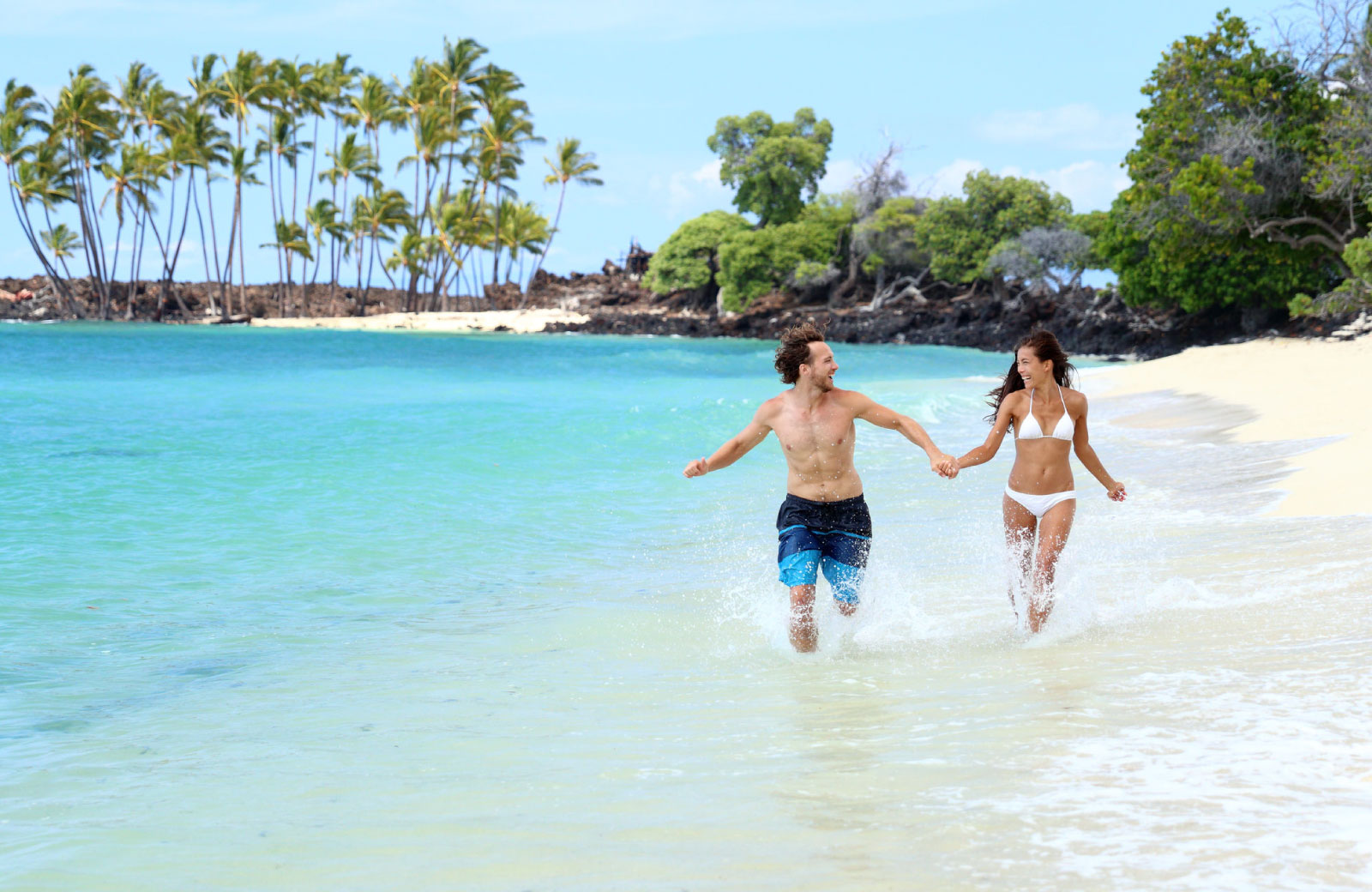 couple running on the beach