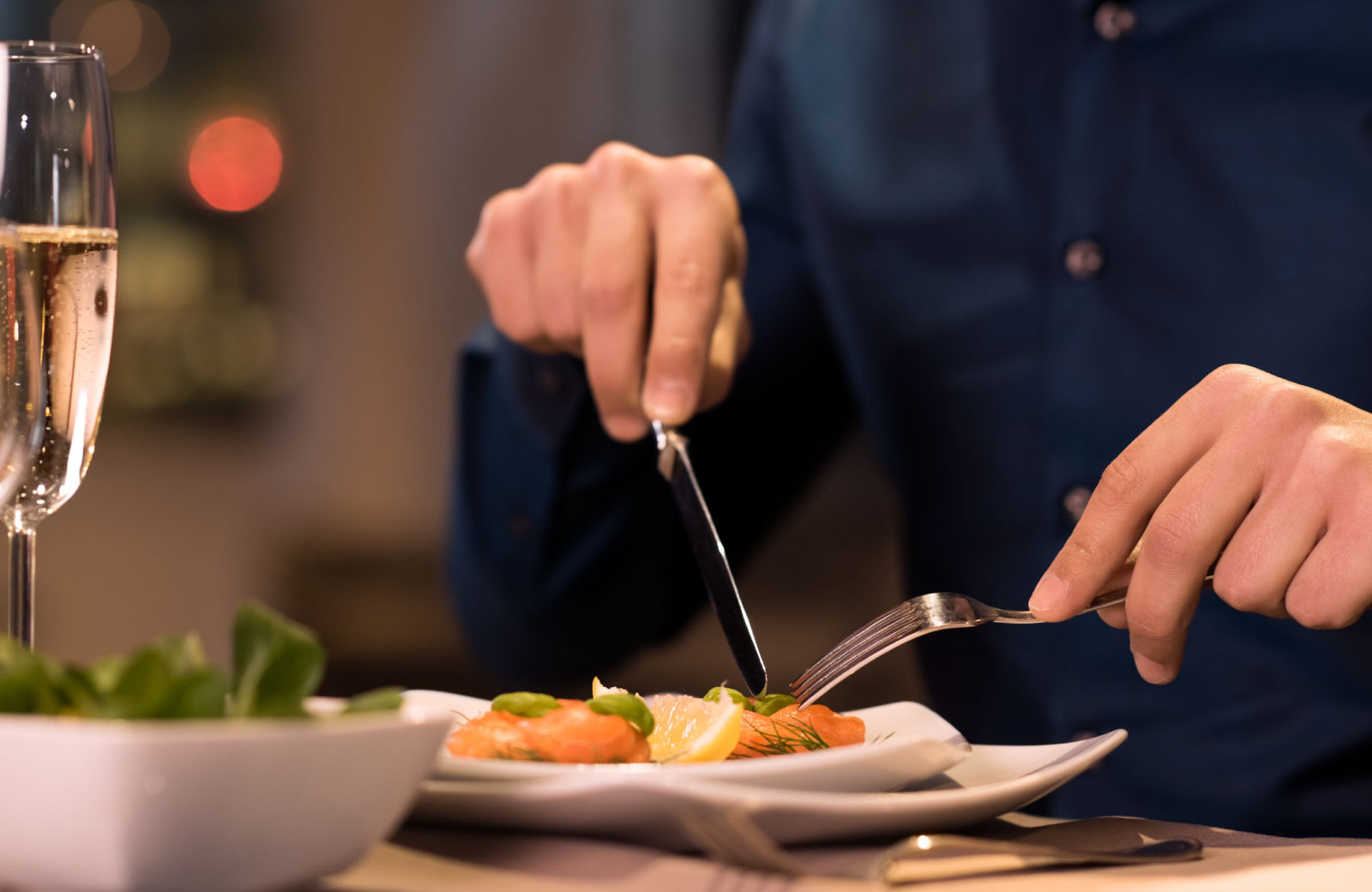person eating with knife and fork