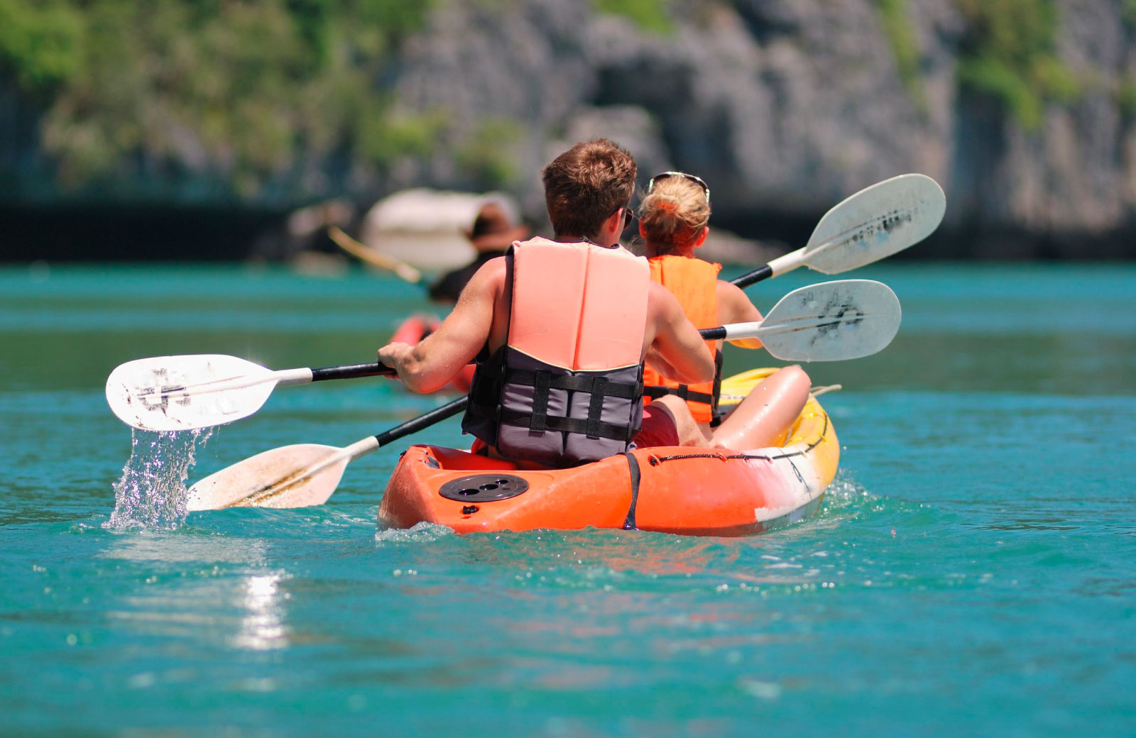 man and woman on kayak