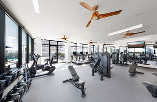A fitness center with cardio and weigh stations