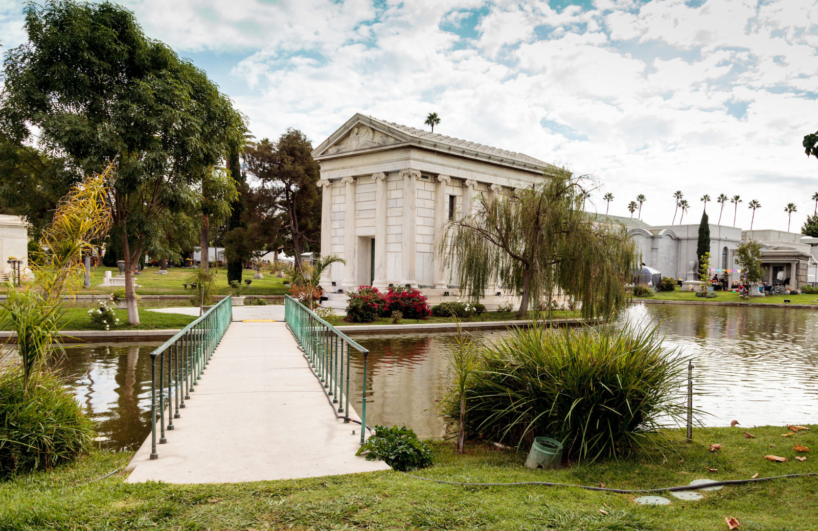 view of hollywood fever with pond in front