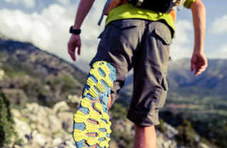 man hiking on a trail