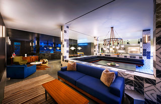 A vibrant common space with lounge and table seating