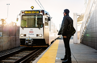 A man catching the commuter train to Union Station