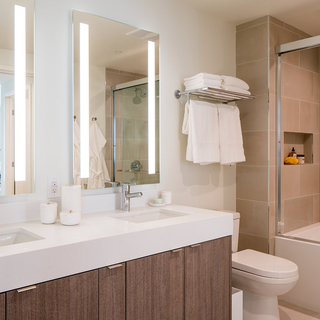 Apartment bathroom with double vanity at Atelier